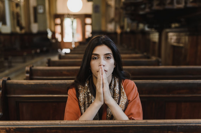 woman praying in curch